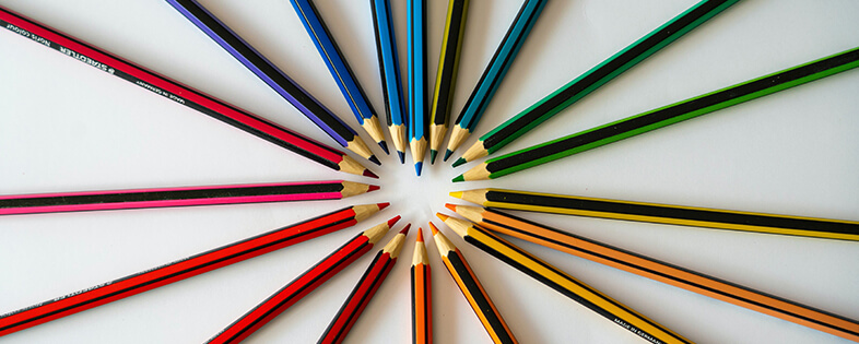Colored pencils forming a heart shape